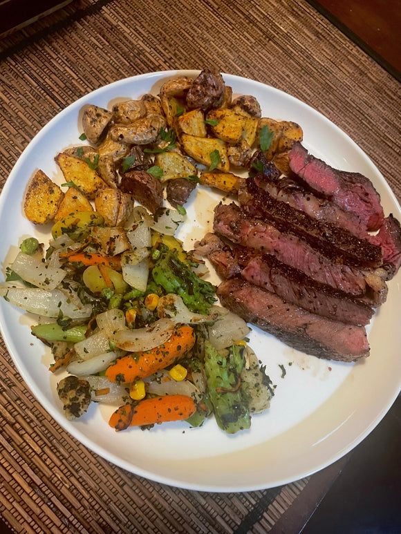 Garlic-Herb Ribeye Steak With Crispy Potatoes & Roasted Veggies